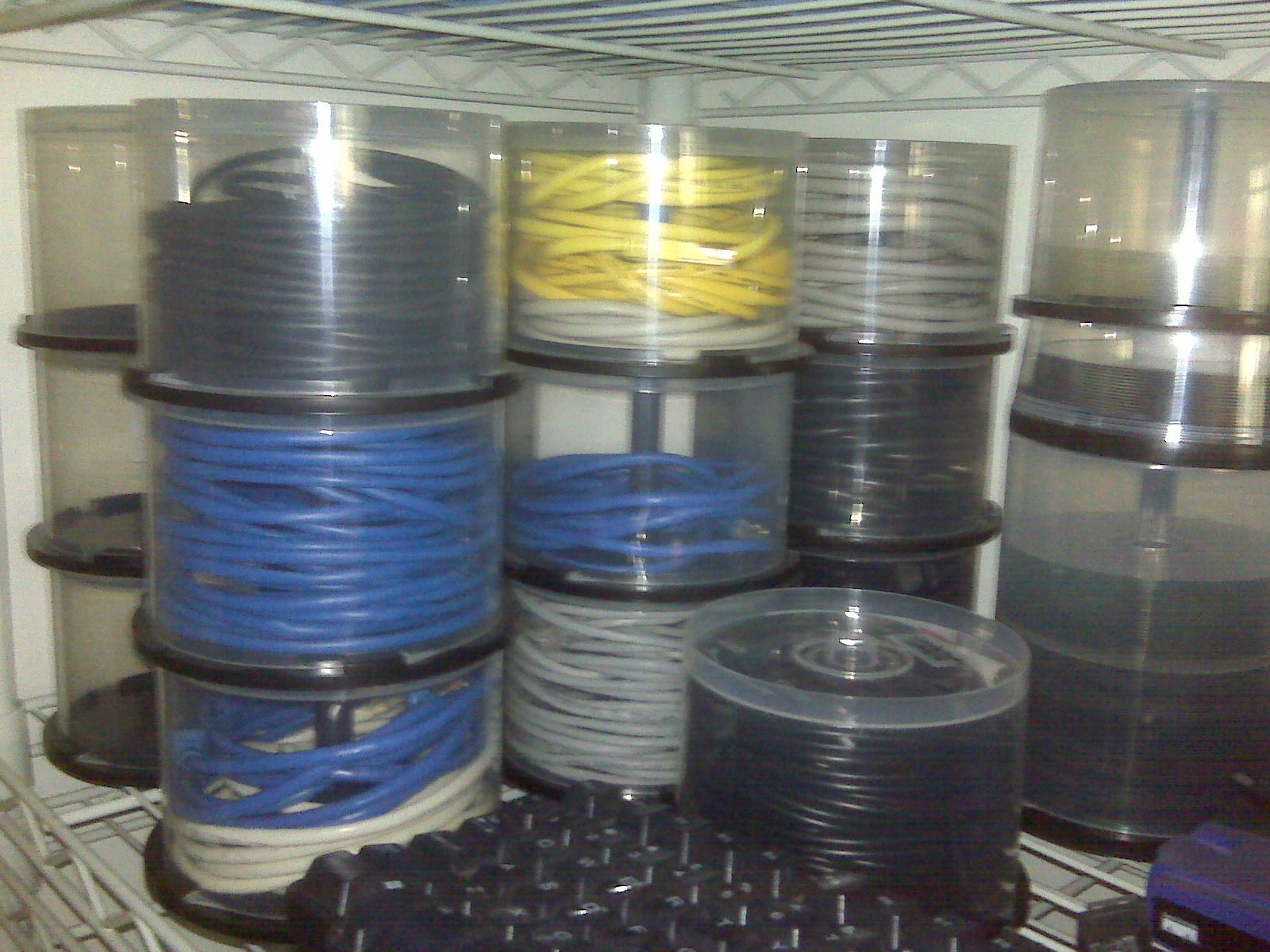 Reusing old optical disc spindles for cable storage